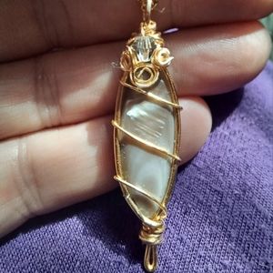 Beautifully wrapped, wire wrap shell pendant.